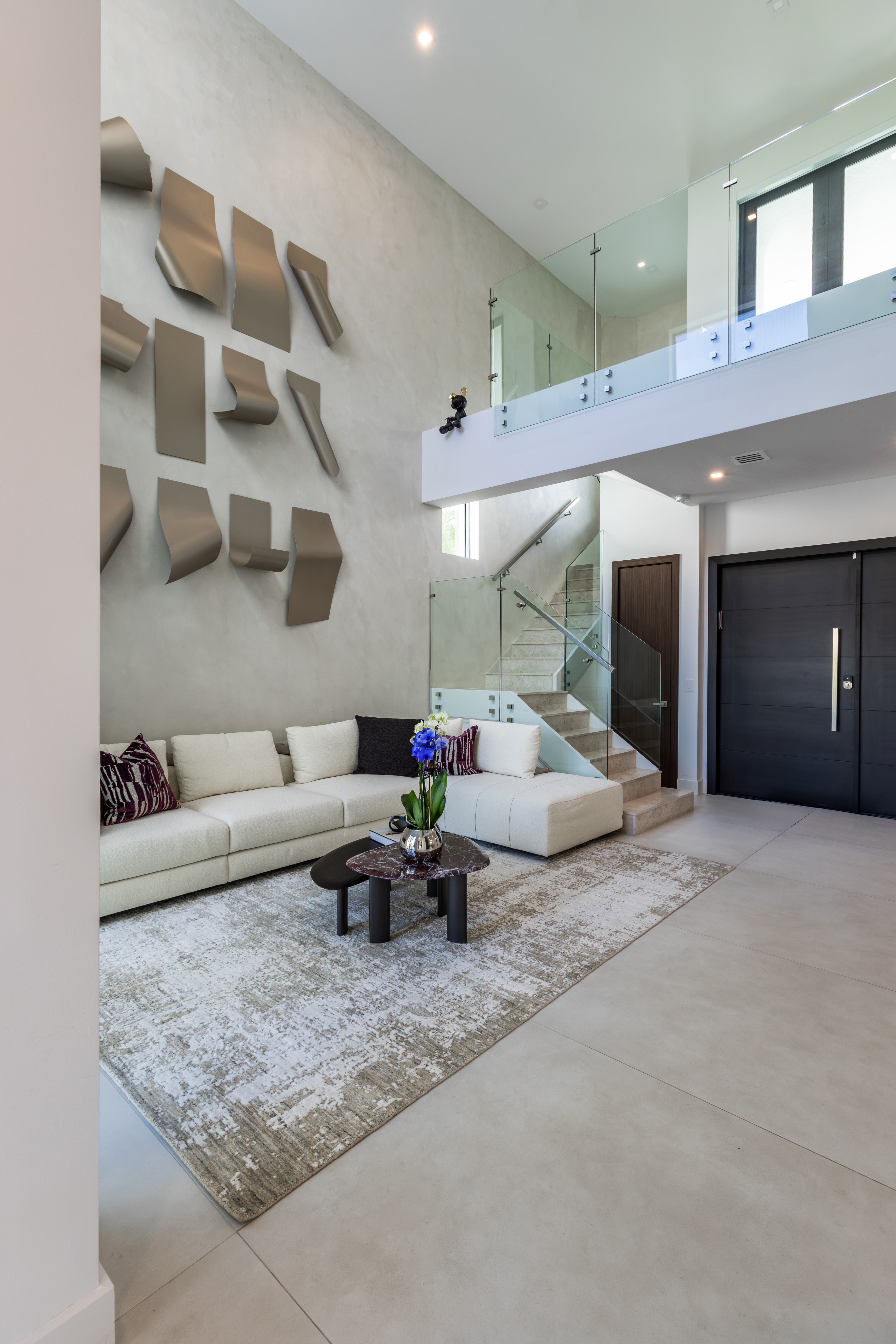 Double-height living room with art wall