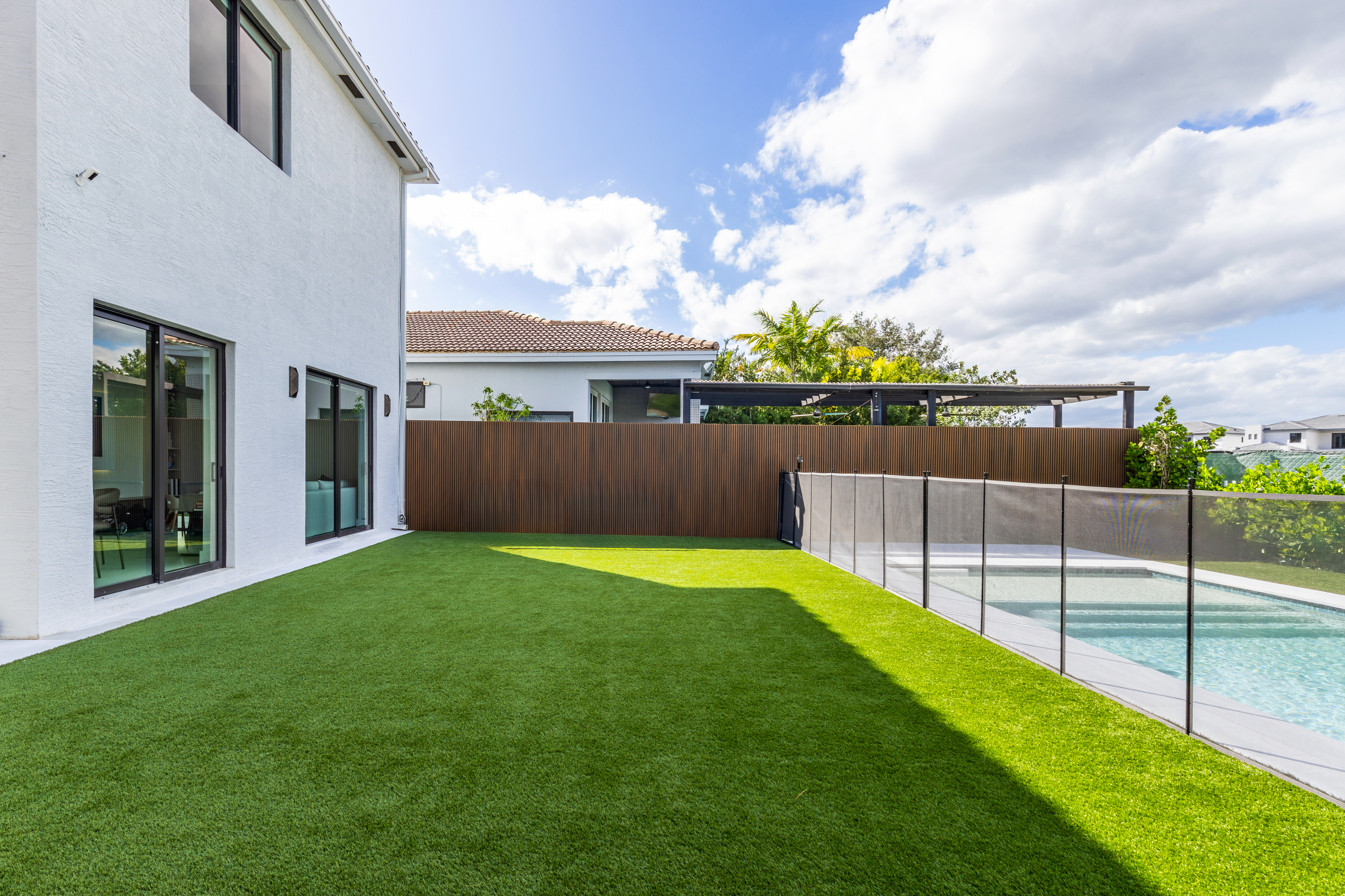 Backyard with pool and lawn