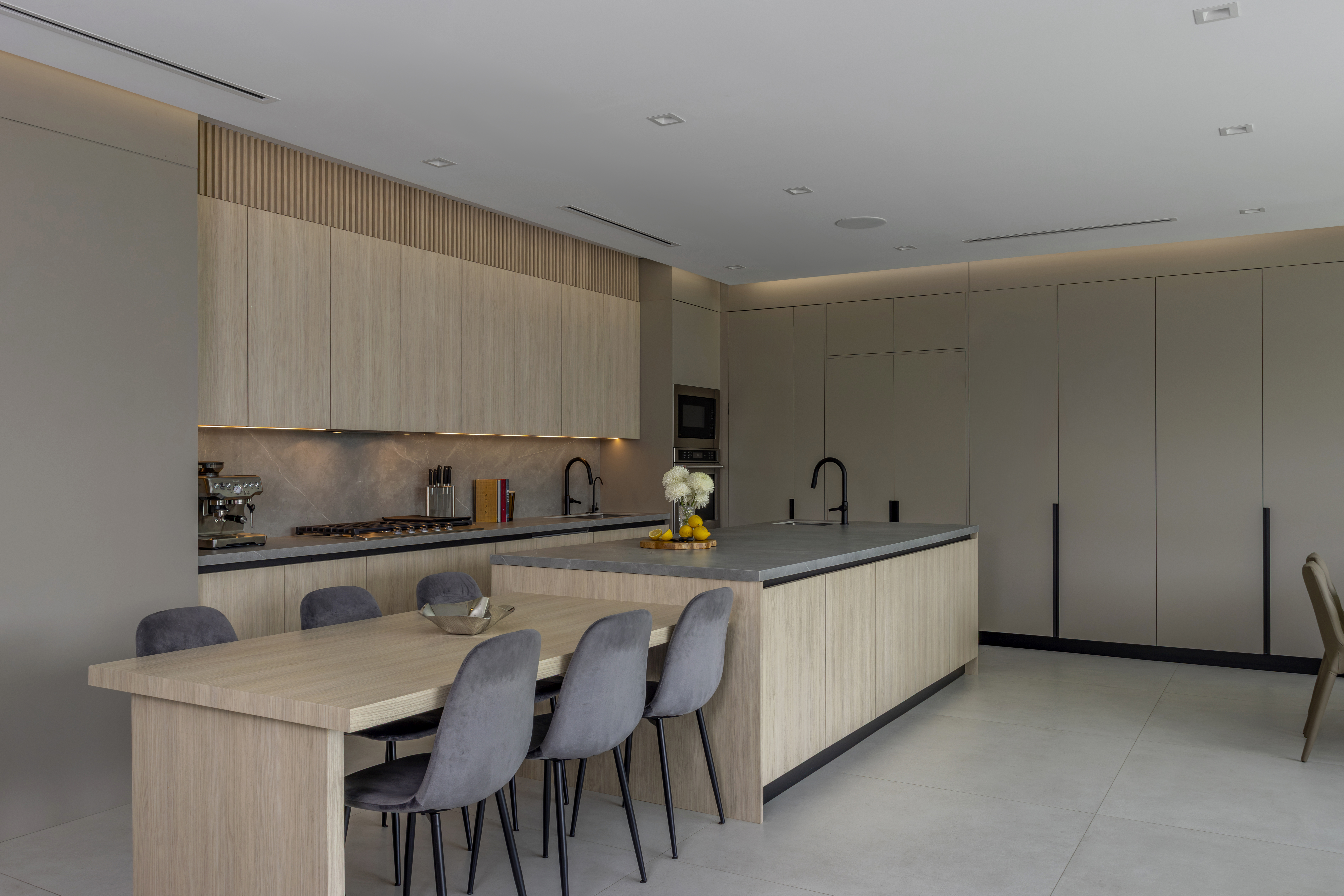 Kitchen — full view with fluted oak uppers and island
