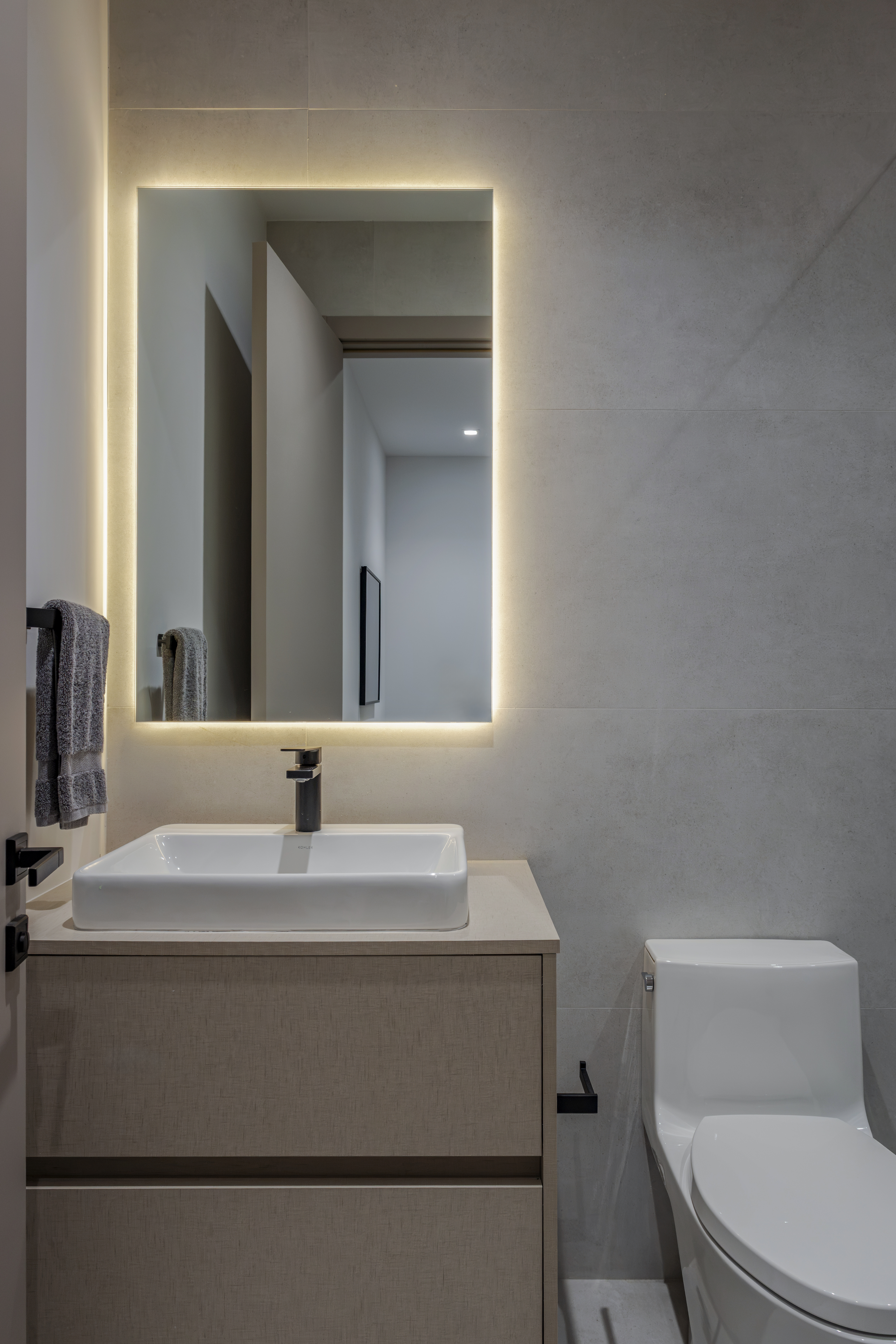 Bathroom — single vanity with backlit mirror