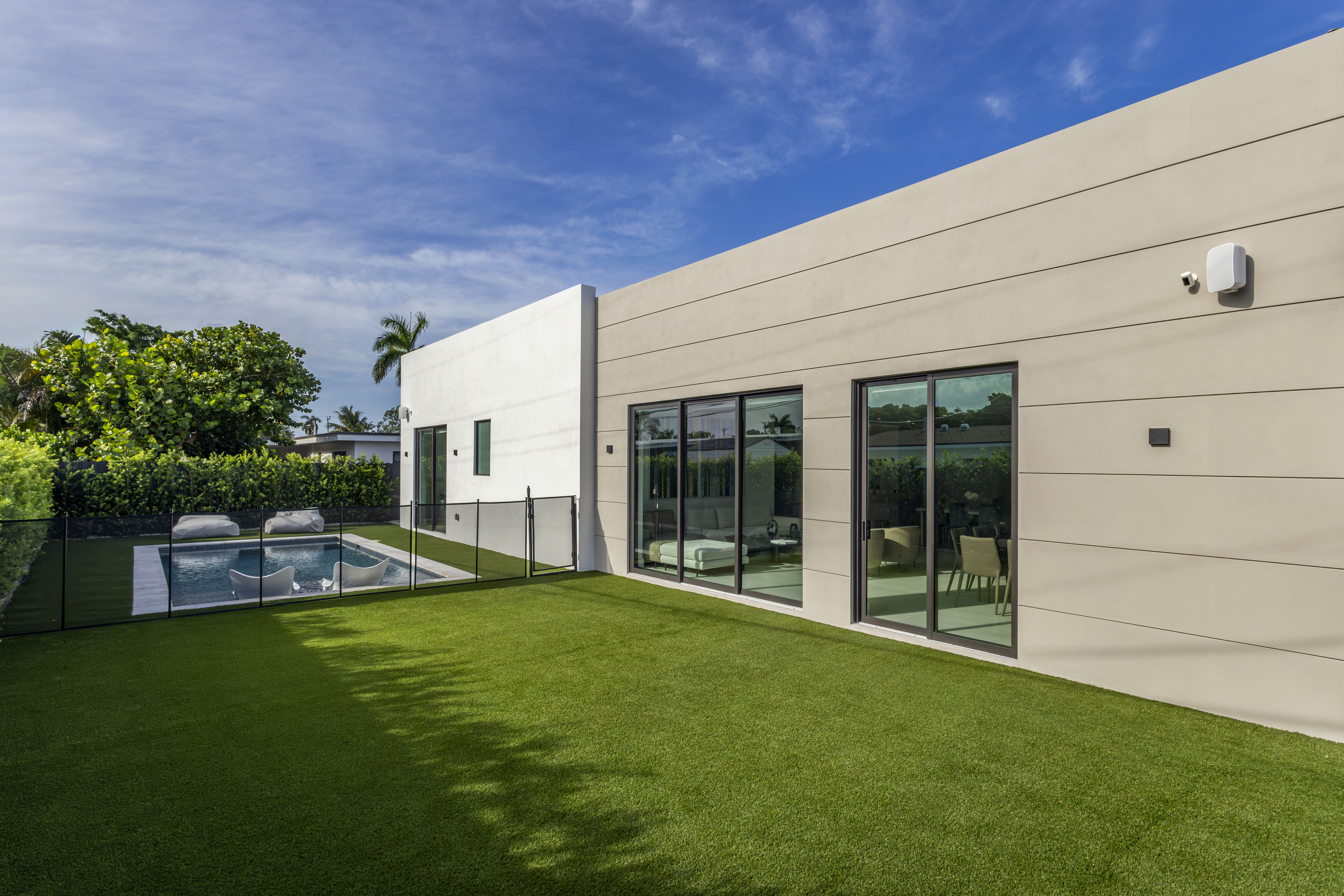 Exterior — backyard with pool and lawn