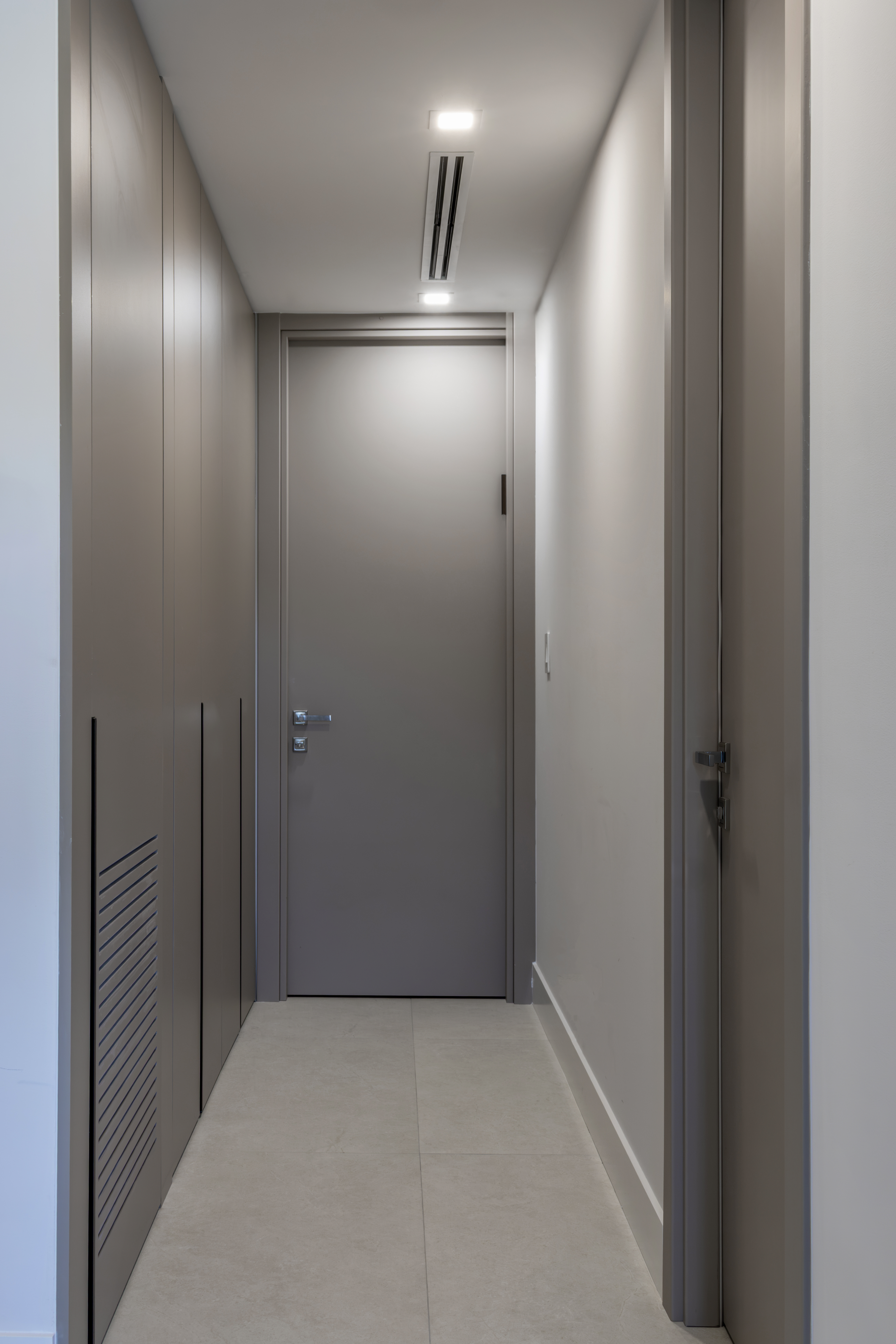 Hallway with built-in cabinetry