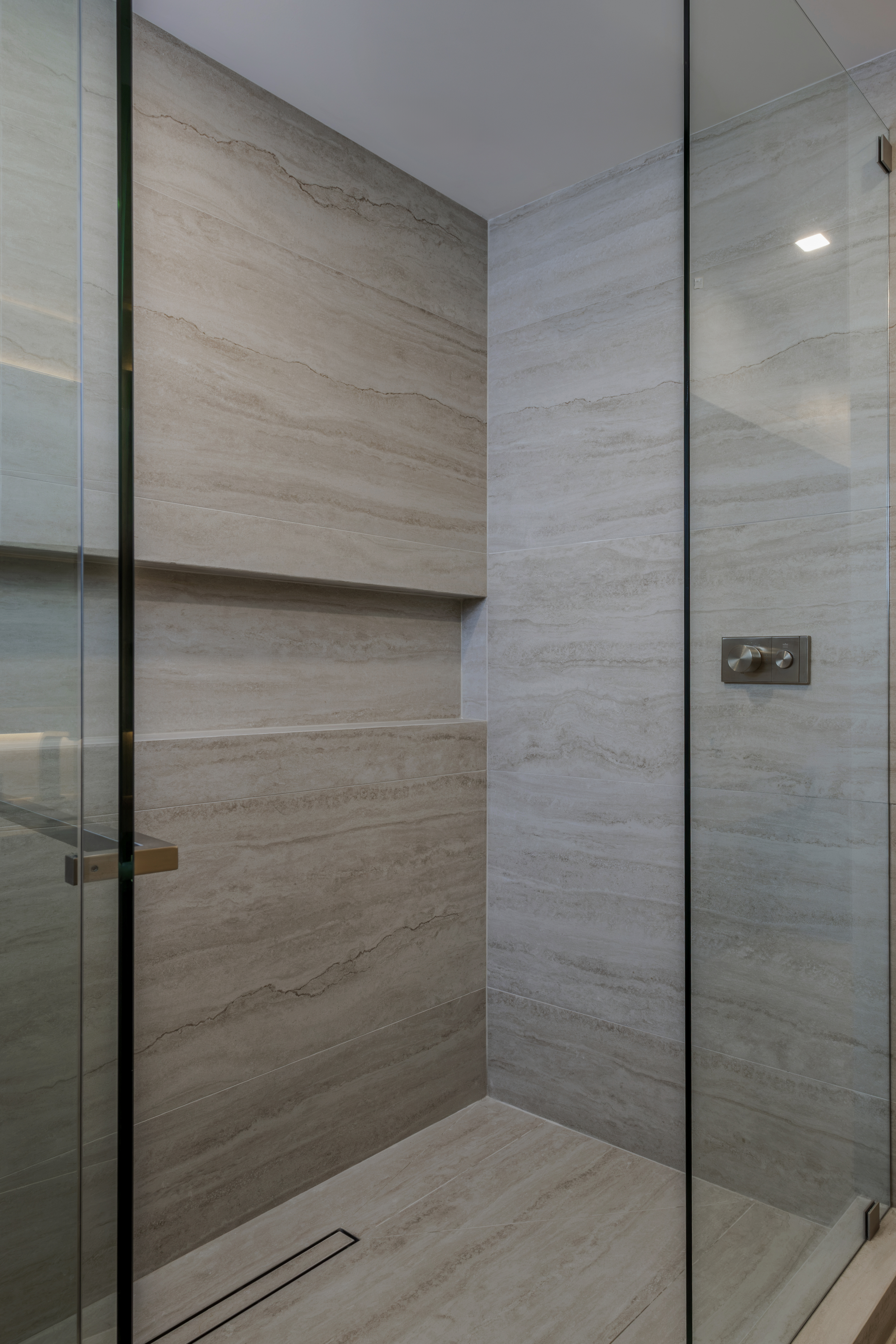 Master shower — corner stone tile detail