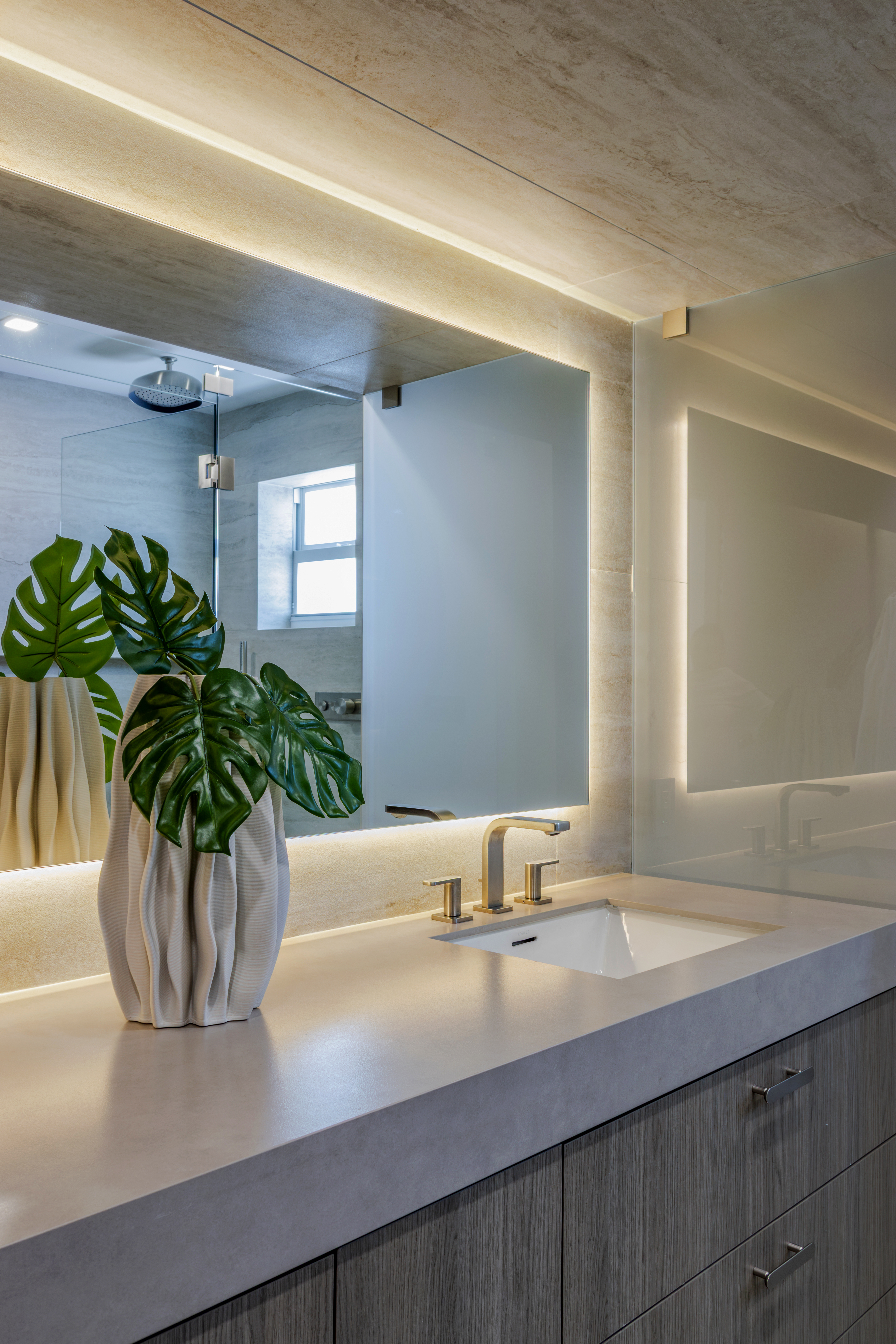 Master bath — sink with monstera vase