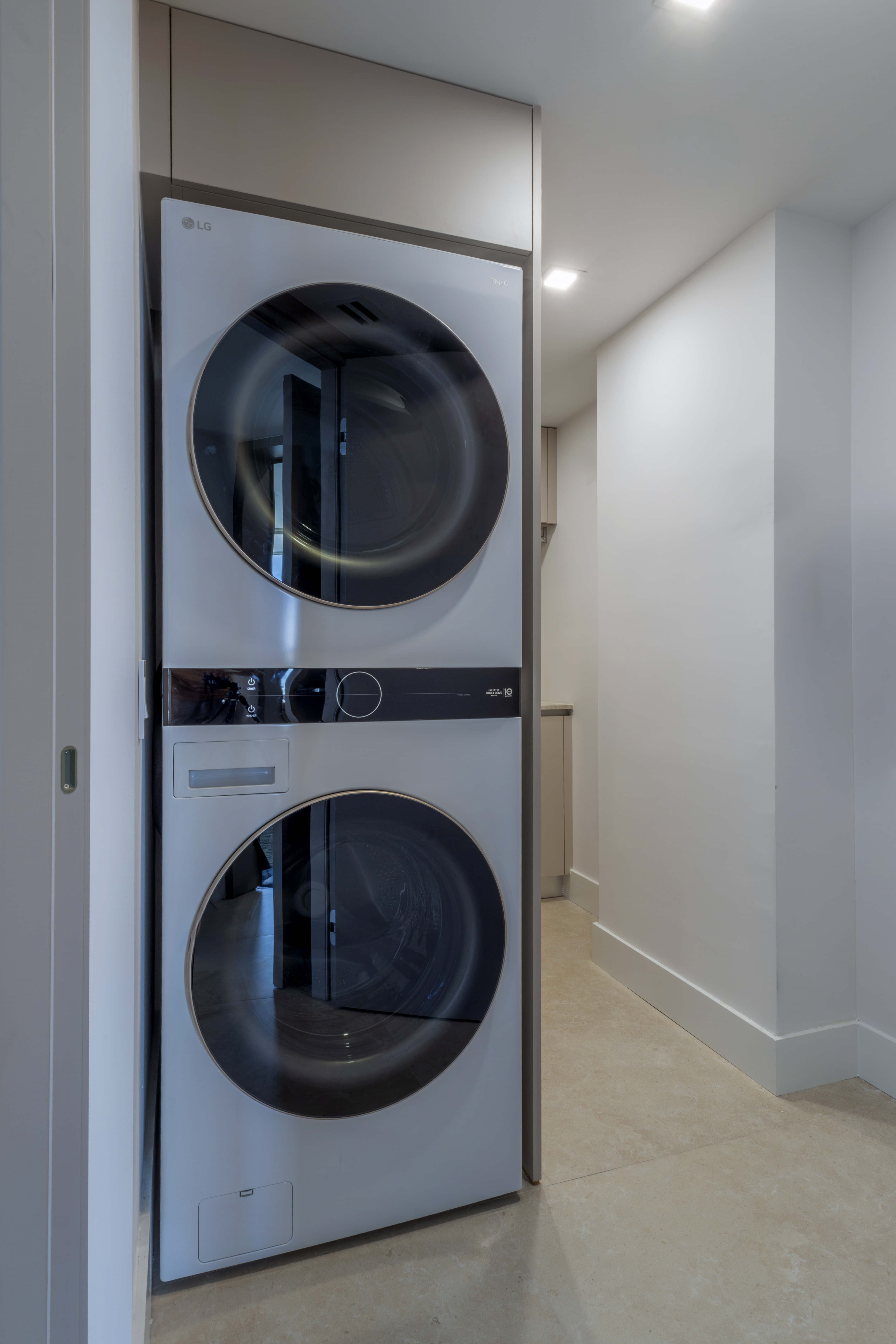 Utility closet — LG stacked washer and dryer