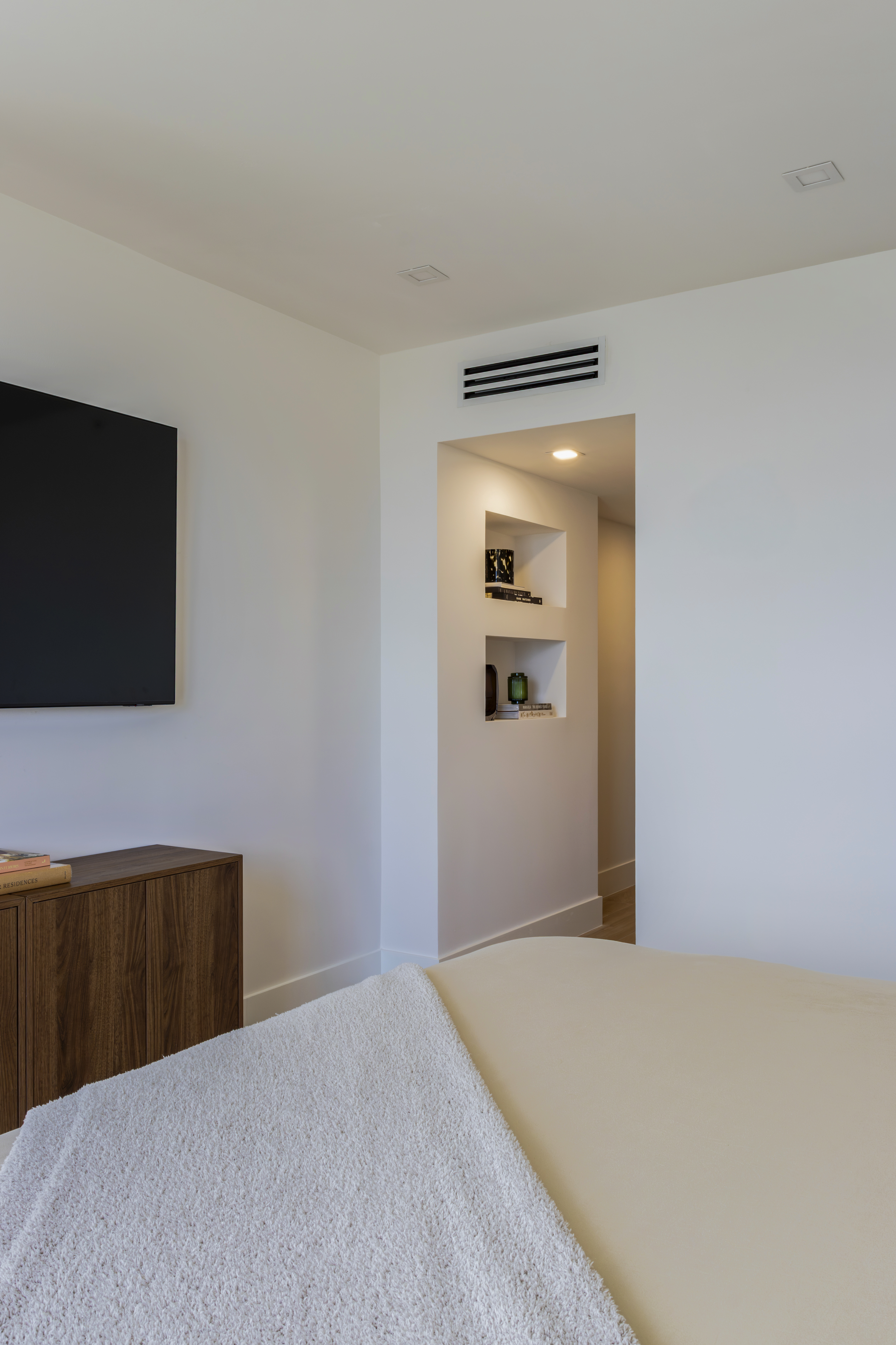 Master bedroom — TV wall and hallway niche shelving