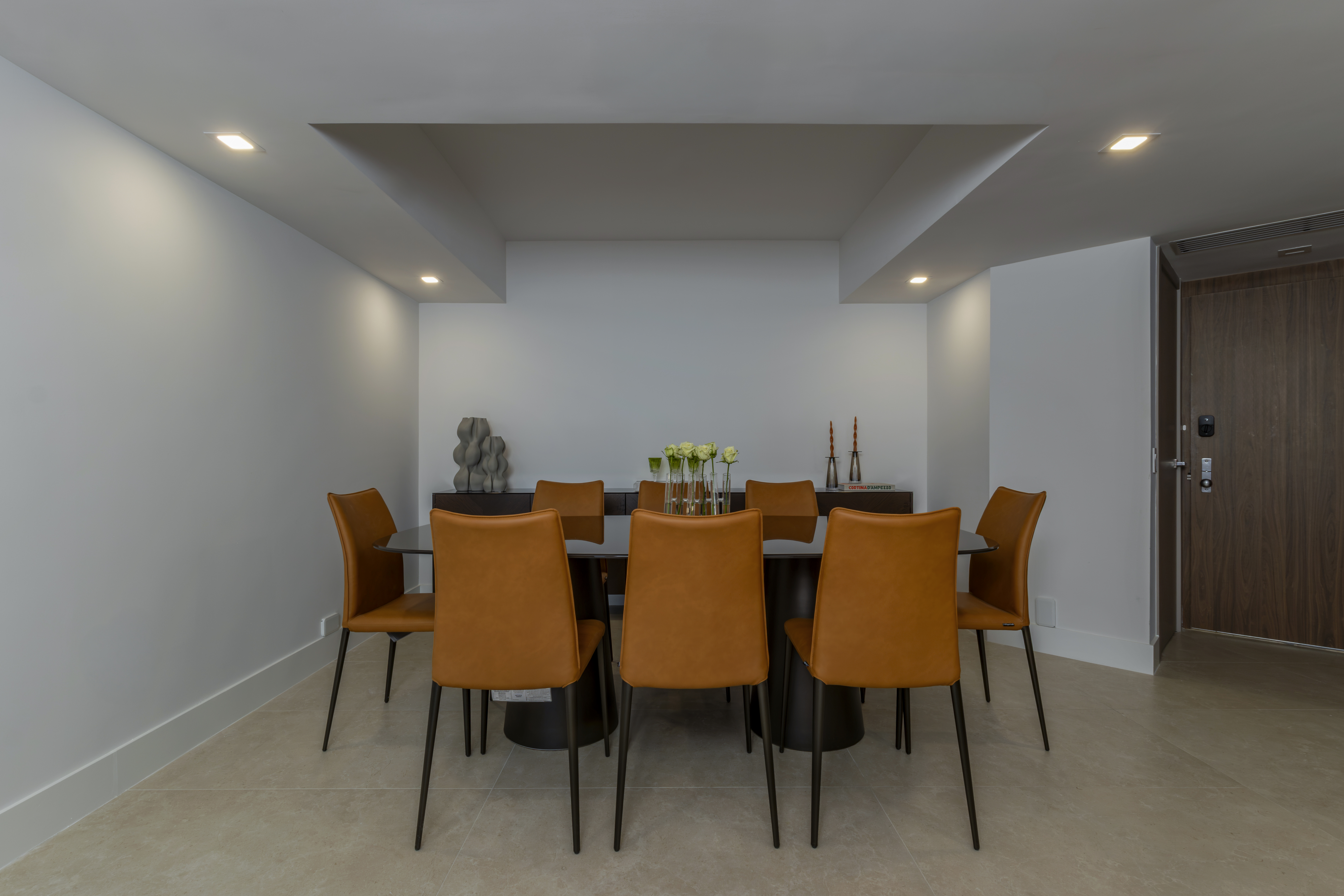 Dining room with leather chairs and coffered ceiling