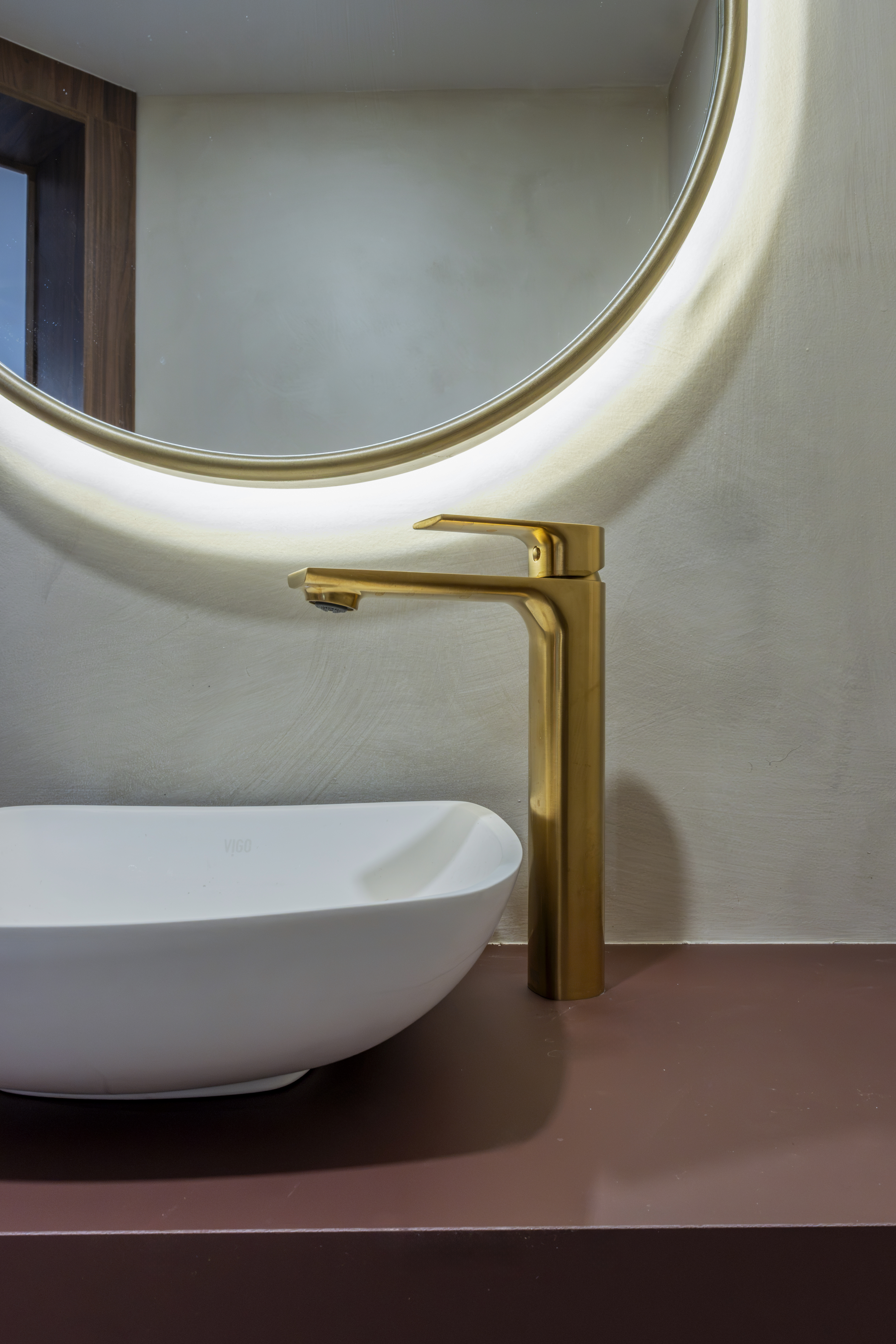 Powder room — brushed gold faucet detail