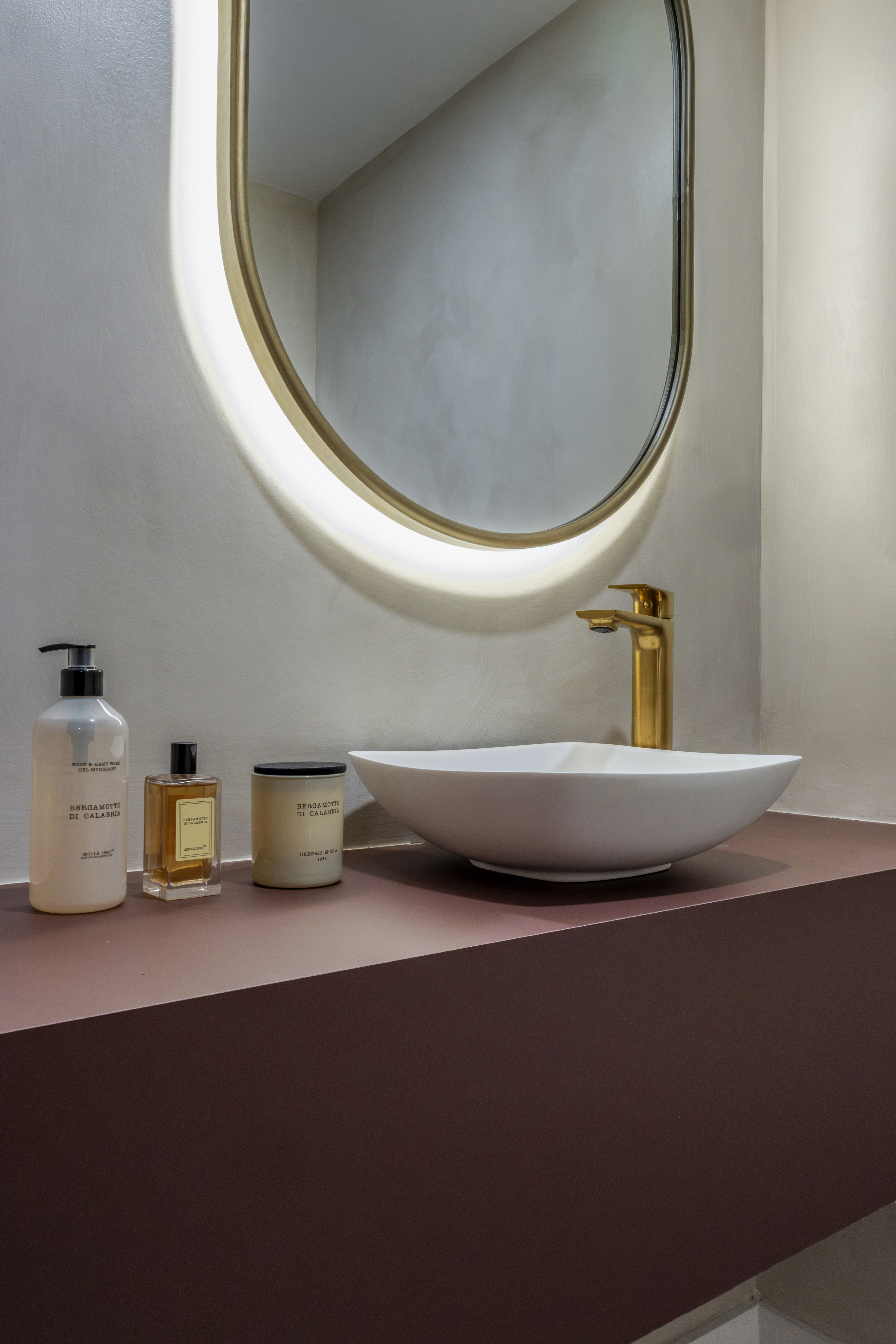Powder room — vessel sink close-up with amenities