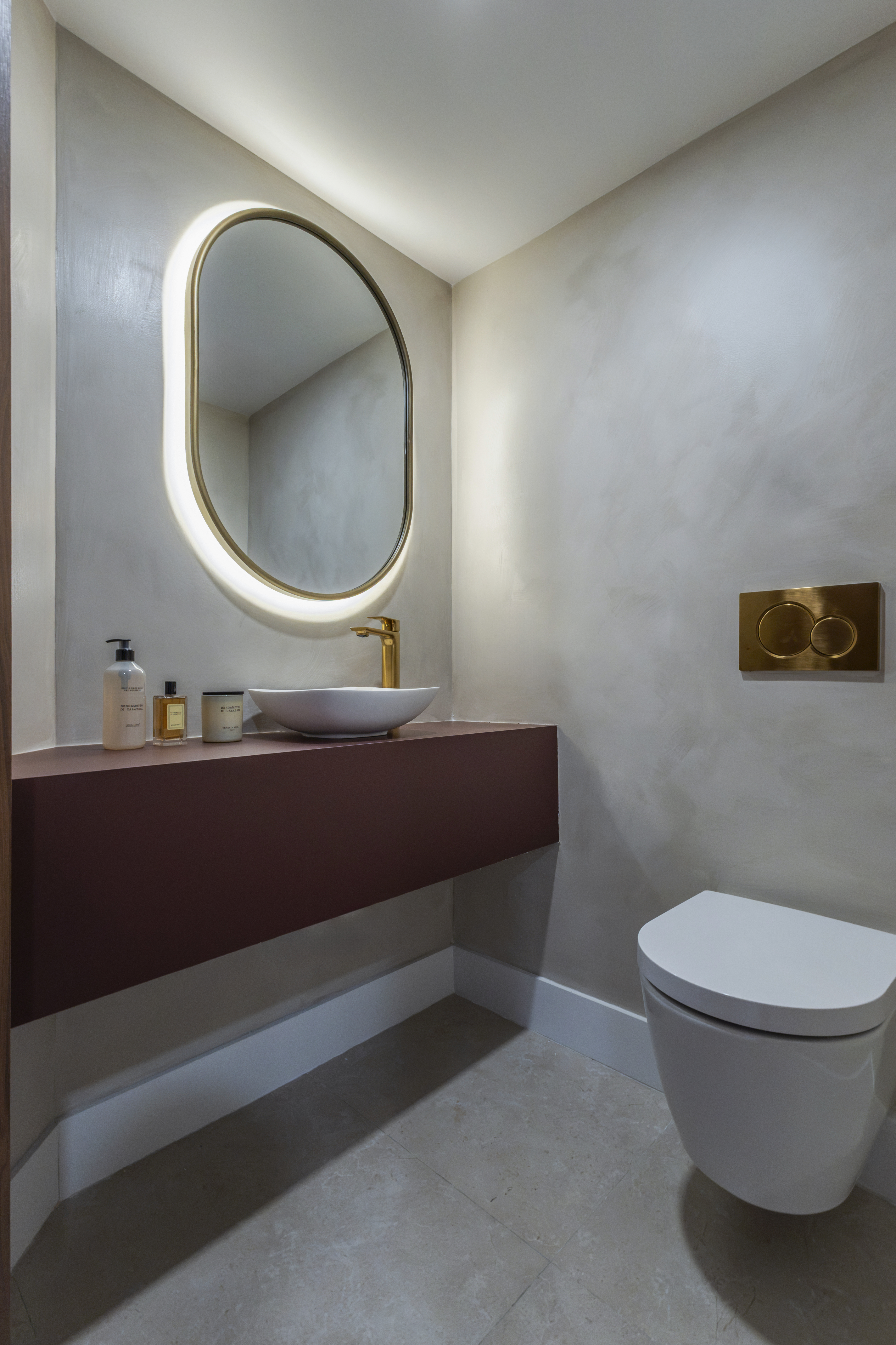 Powder room — vessel sink and gold flush plate
